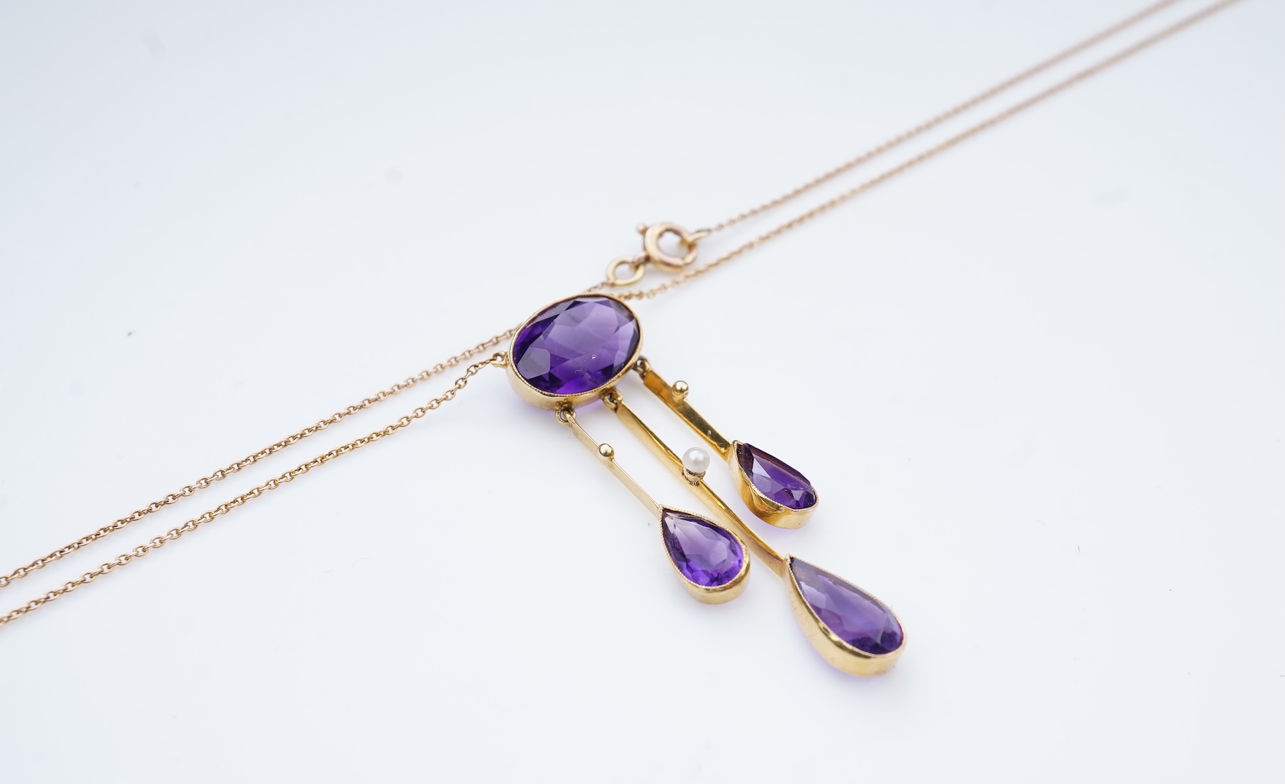 An Edwardian amethyst and seed pearl pendant, circa 1910